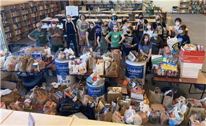 Maplewood students standing in front of donations